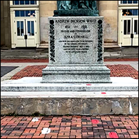 Cornell Arts Quad, statue of A.D. White with painted footprints in the foreground